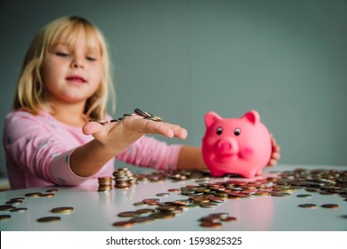 Child Saving Money, Cute Girl Put Coins Into Piggy Bank