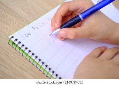 Child, Schoolboy, Writes Words, Letter To Friend In English In A Notebook With Pen, Education Concept, Elementary School, Hand Development, Chatting With A Distant Pen Pal, Back To School