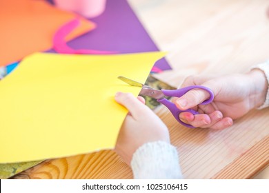 Child With Scissors Cut Paper