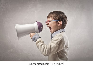 Child Screaming Into A Megaphone