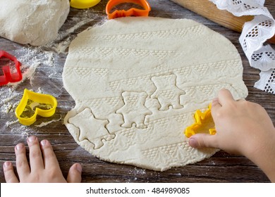 Child Sculpts Christmas Decorations From Salt Dough. Children's Art Project, A Craft For Children.