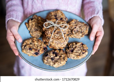 Child Is Serving Easy To Prepare And Healthy, Homemade Oatmeal And Blueberry Cookies - During Stay At Home