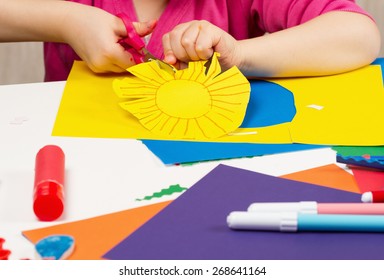 Child Shearing Action Shooter From Colored Paper