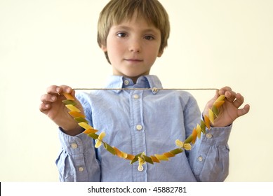 Child Showing A Selfmade Necklace