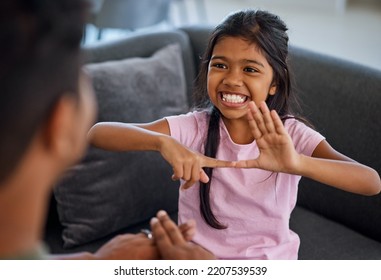 Child, Sign Language And Learning To Communicate With Deaf Girl Or Parent While Making Fingers And Showing Visual Symbols At Home. Happy Kid With Hearing Disability Or Loss Sitting With A Tutor