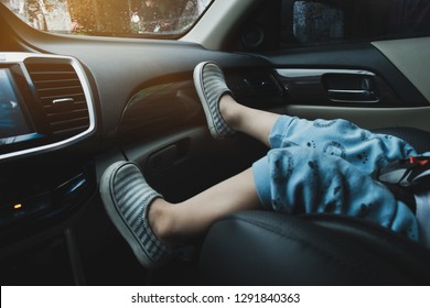 Child Sitting On Front Seat Of Car