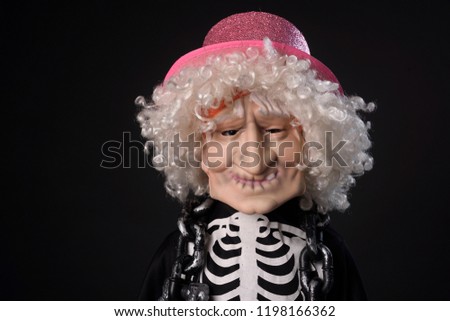 A child in a skeleton costume. Trick or treat. Halloween celebration.