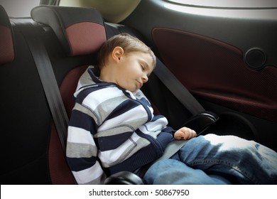 Child Sleeping In A Car