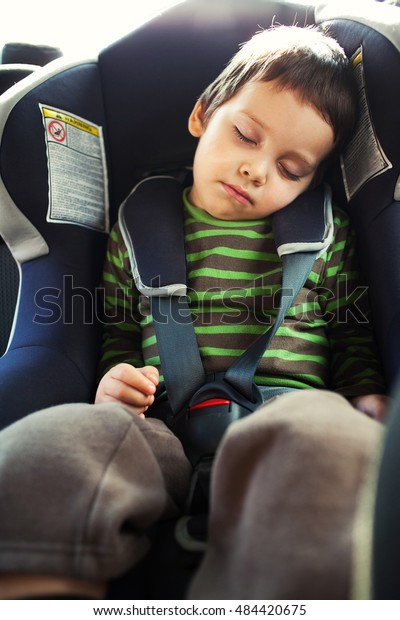 Child sleeping in car safety\
seat 