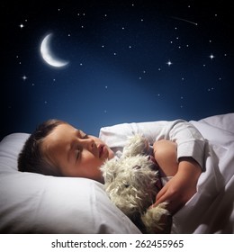 Child Sleeping And Dreaming In His Bed Under The Moon, Stars And Blue Night Sky