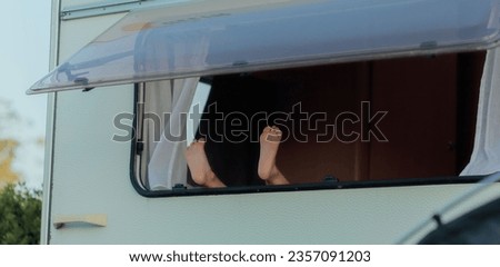 Similar – bare foot at the window