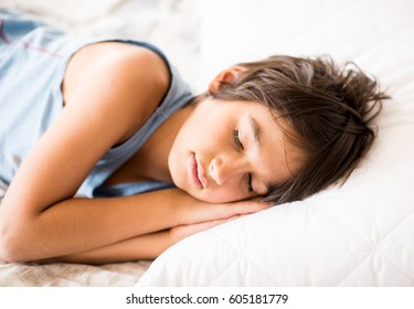 Child Sleeping On Bed In Bedroom Pillow