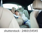 Child sleeping peacefully with seatbelt in car seat