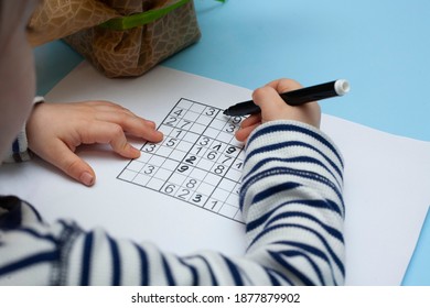 Child Solves Japanese Crossword Sudoku