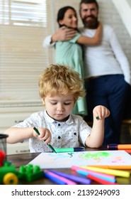 Child Son With Father And Mother Drawing At Home. Family Holiday And Togetherness. Mom, Dad And Child Boy, Holiday And Togetherness. Kids Early Arts And Crafts Education, Drawing.