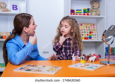 Child With Speech Therapist On Therapy