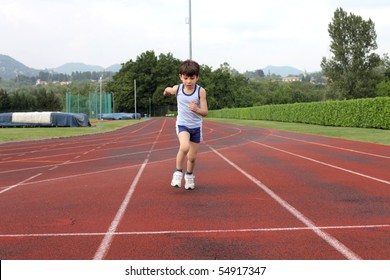 Child Standing On A Running Track