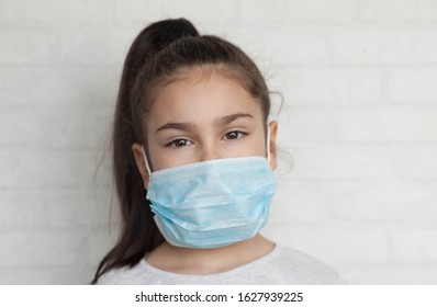 Child In A Sterile Medical Mask. Sick Little Girl. Epidemic Of Flu. Virus, Coronavirus.