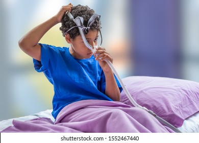 Child Suffering From Sleep Apnea, Using A CPAP Machine