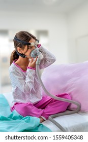 Child Suffering From Sleep Apnea, Using A CPAP Machine