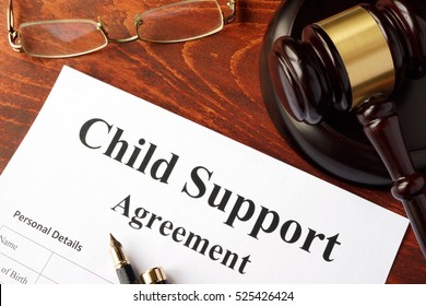 Child Support Agreement On An Office Table.