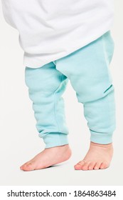 Child In Sweat Pants With Barefoot