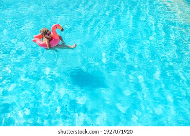 child swims and dives in the pool. Selective focus. Kid.