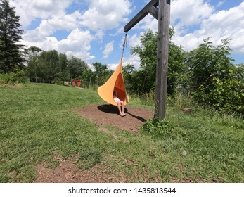 Child Swinging In A Cocoon Style Hammock