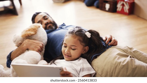 Child, tablet and relax in home with father, streaming media and online game for entertainment. Man, daughter and tech on living room floor for cartoon, relationship development or bonding on weekend