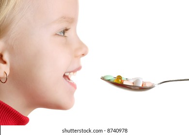 Child Takes Vitamins By Spoon