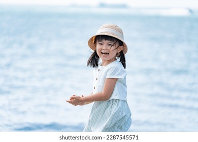 A child taking a walk on the beach - Powered by Shutterstock