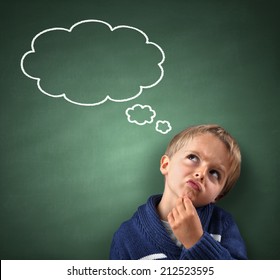 Child thinking with a thought bubble on the blackboard concept for confusion, inspiration and solution