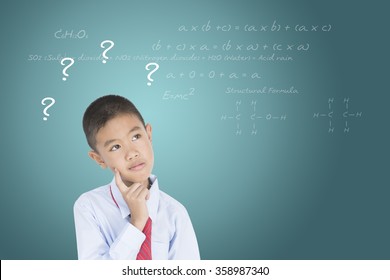 Child thinking with a thought bubble on the blackboard concept for confusion, inspiration and solution
