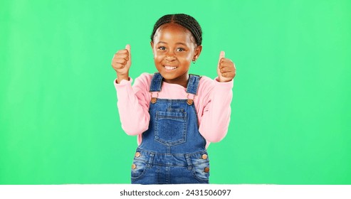 Child, thumbs up and portrait by green screen with smile for like, thanks or vote for agreement. Girl, African kid and happy with emoji, icon and sign language by chromakey with feedback for decision - Powered by Shutterstock