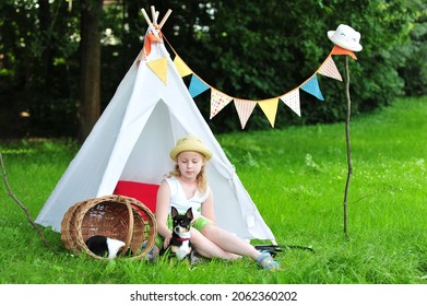 A Child In A Tipi With Her Chihuahua Outside