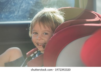 Child, Toddler Boy, Sitting In Car Seat, Eating Chocolate, Being Angry