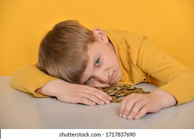 The Child Took All The Coins For Himself And Does Not Want To Share With Anyone.