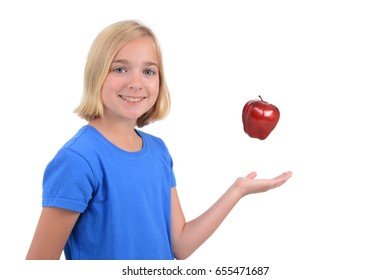 Child Tossing Apple Up In Air White Background