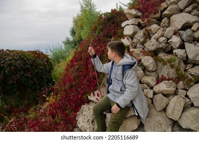 Child Tourist Sat Down On The Rocks