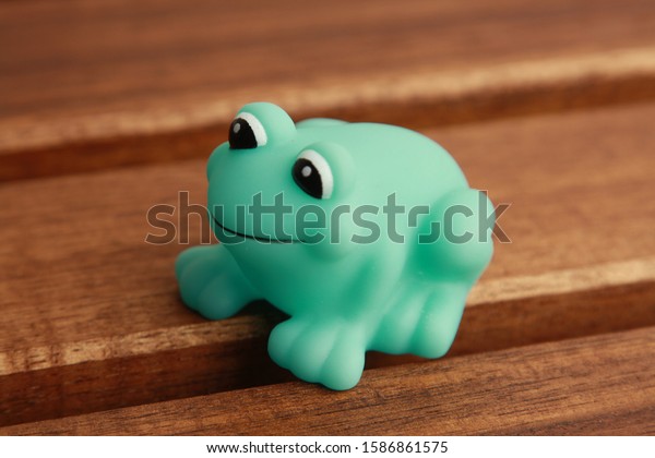 child toy for green frog\
bathtub
