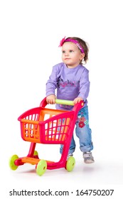 Child With A Toy Shopping Trolley