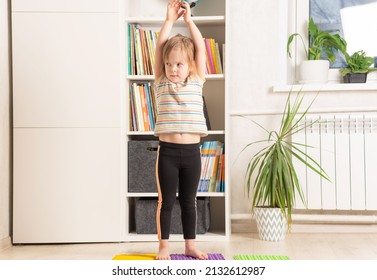 The Child Trains At Home: Fitness, Yoga, Exercises. Distant Training With Personal Trainer, Social Distance, Online Education Concept. Physical And Mental Health Trend