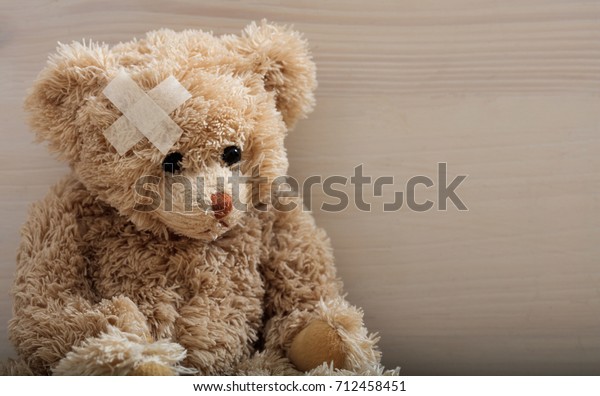 teddy bear with bandage on head