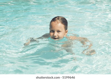 Child Treading Water In The Pool