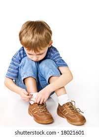 Child Try To Tie Shoelaces