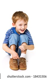 Child Try To Tie Shoelaces