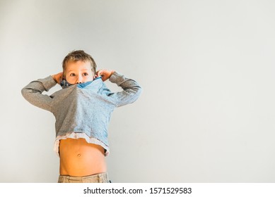 Child Trying Take Off His Shirt Stock Photo 1571529583 | Shutterstock