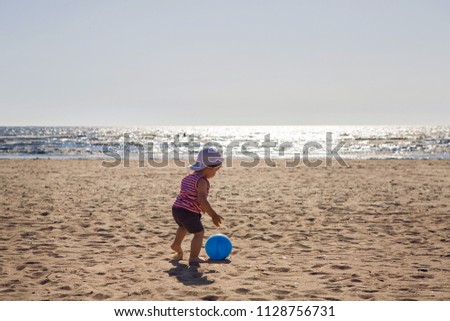 Similar – Girl and senior woman playing on the beach