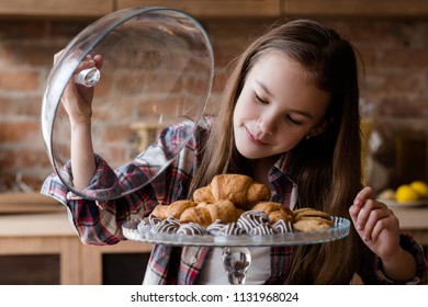 Child Unbalanced Eating. Unhealthy Bad Habits. Confectionery And Puff Pastry Overeating. Little Girl Drooling Over Croissants And Chocolate Sweets