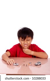 Child Under Meditation Of Sore Throat Playing Toy Car